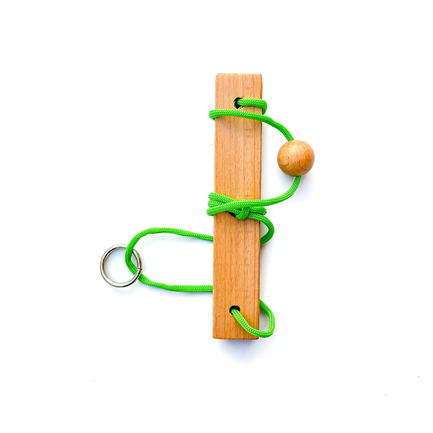 String Puzzle with green rope having a ring and a ball to disentangle.