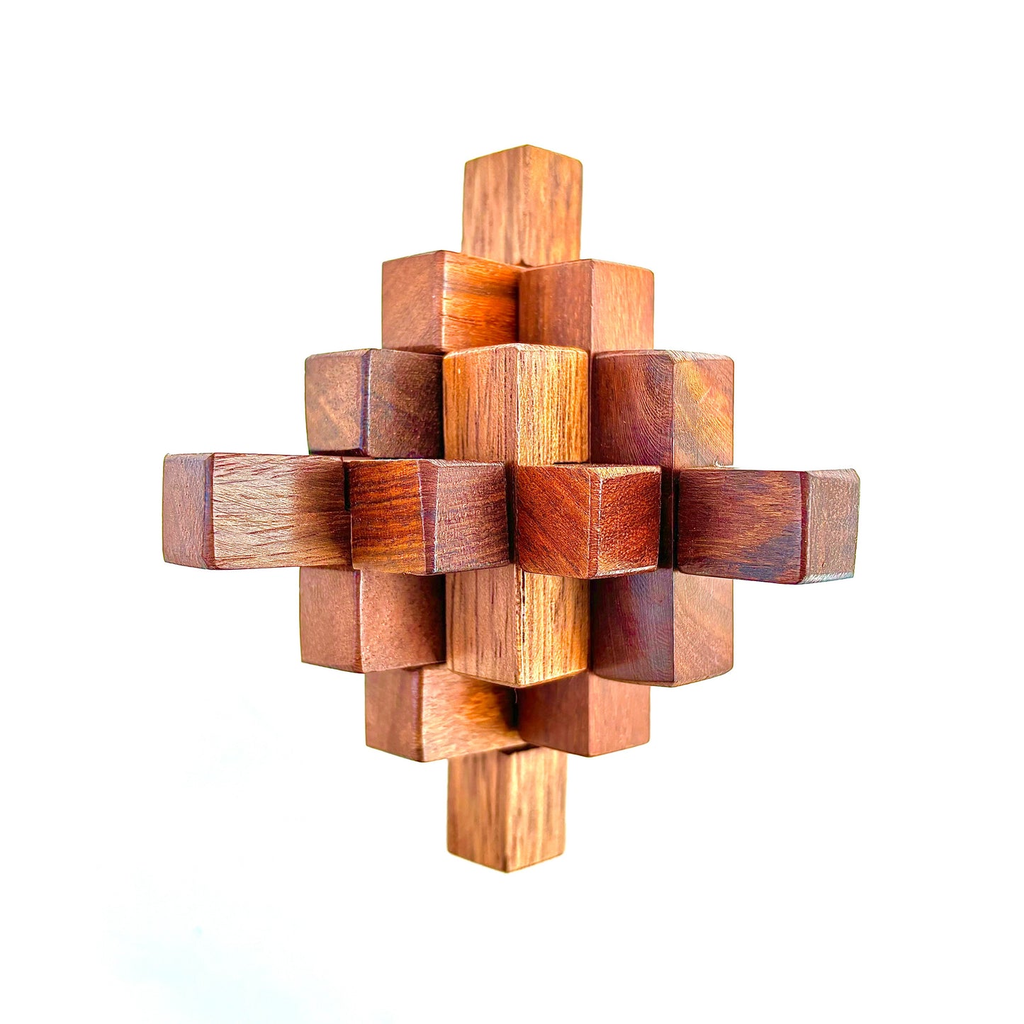 Close-up photo of a wooden cross puzzle on a white background.  This classic brain teaser toy challenges players to separate the interlocking pieces. 