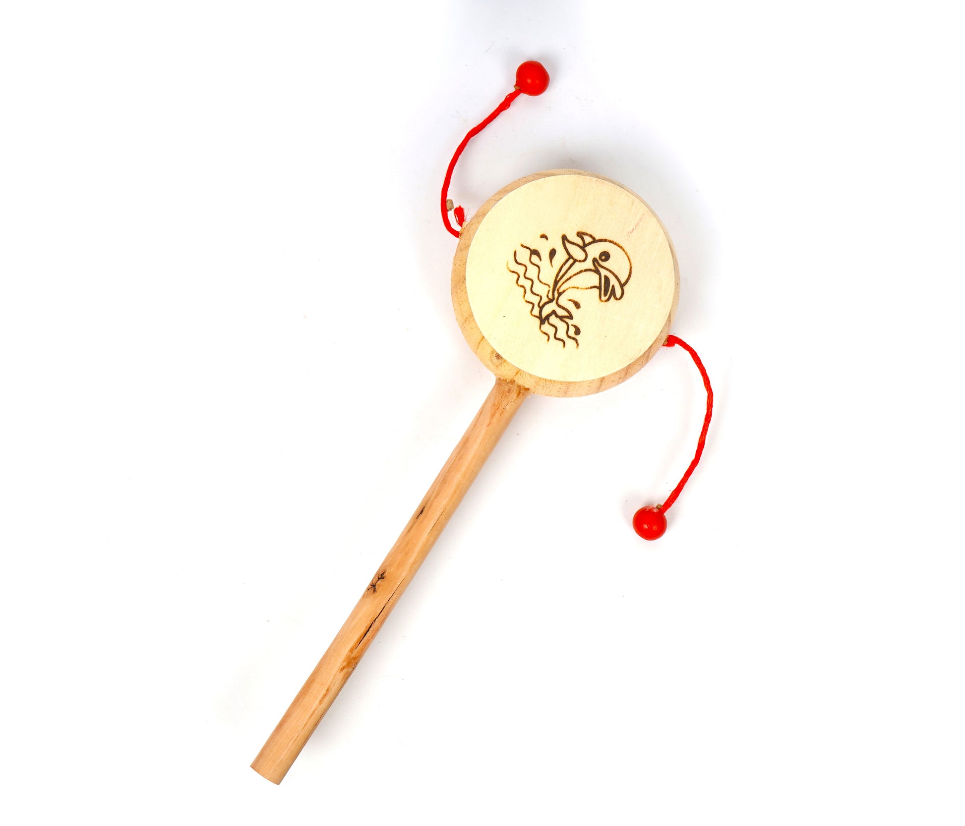 Wooden dolphin on a round drum attached to a wooden stick. This handheld toy is a rattle and used by infants and small children