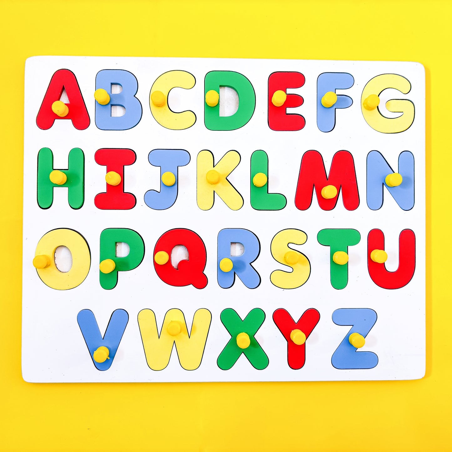 Colorful wooden alphabet puzzle with uppercase letters A to Z on a yellow background.  The puzzle pieces have knobs for easy grasping. This educational toy helps young children learn the alphabet and letter recognition. 