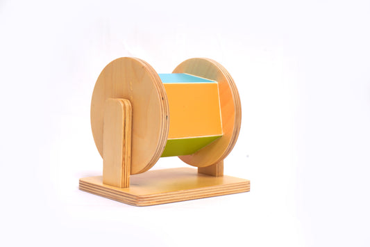 Rainbow Spinning Drum Montessori toy with five colorful arches on a white background