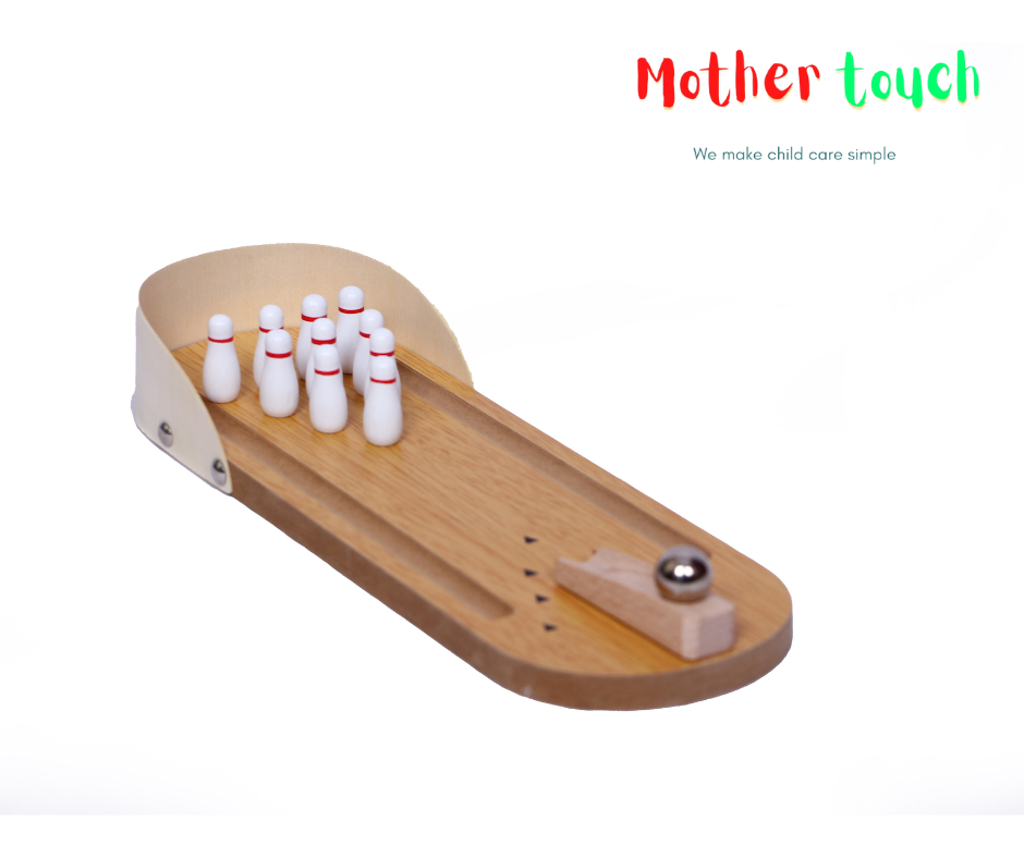 Mini wooden bowling set with 10 pins and a ball on a white background