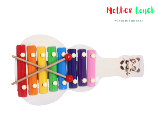 Colorful wooden xylophone/Guitar with 8 metal bars in rainbow colors and 2 wooden mallets on a white background